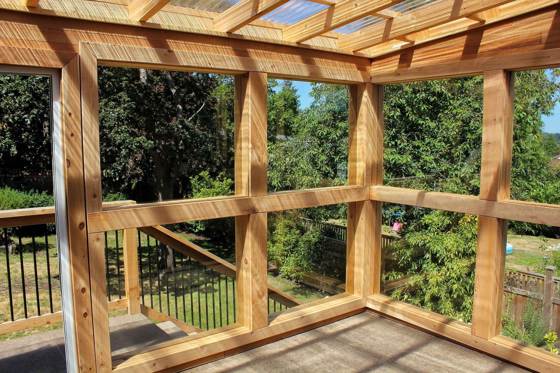 Sunroom constructed of large square windows.